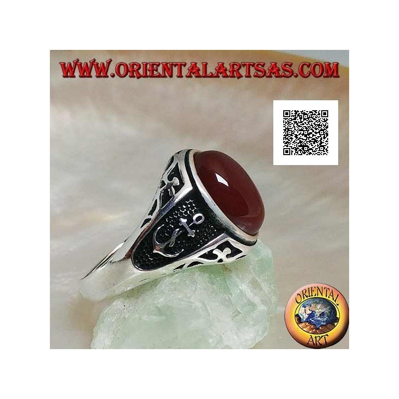 Silver ring with oval cabochon carnelian with engravings and still in relief on the sides