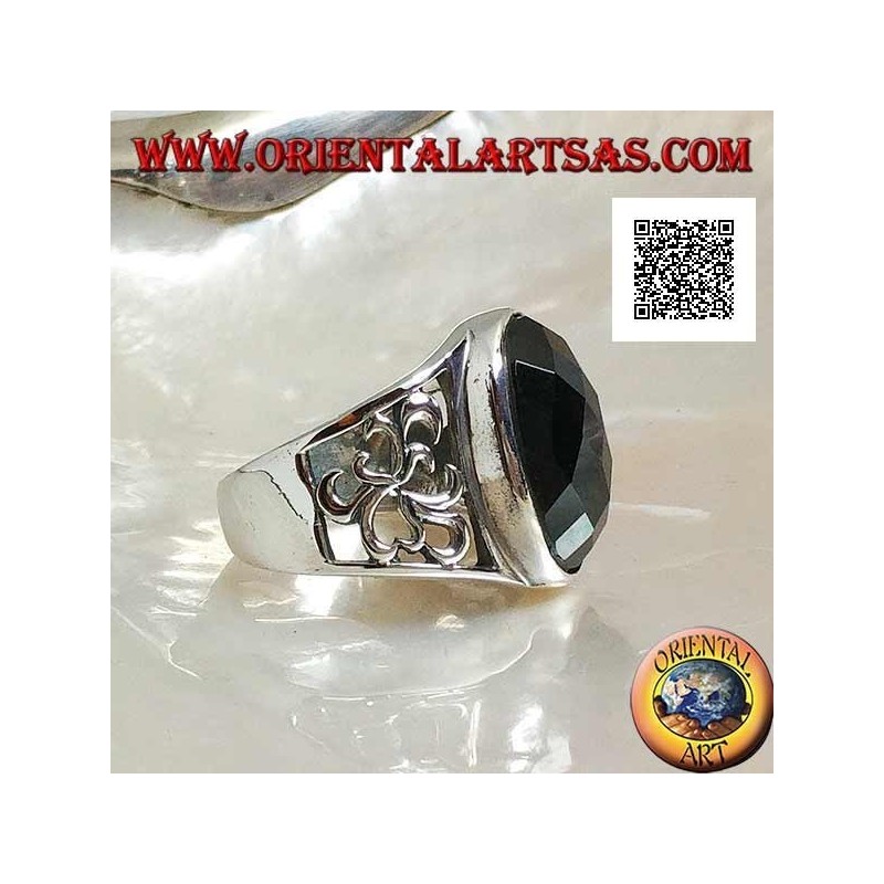 Silver ring with oval faceted onyx and openwork decoration on the sides