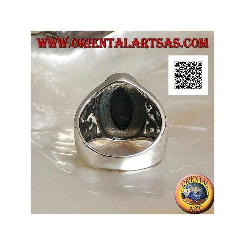 Silver ring with oval faceted onyx and openwork decoration on the sides