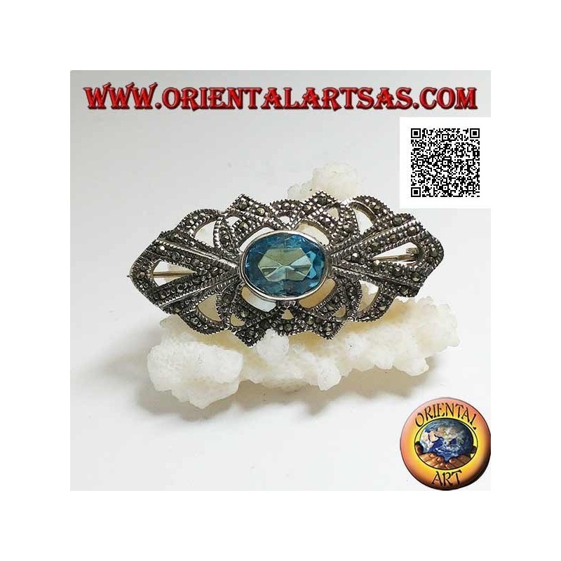 Silver brooch with oval blue topaz and openwork decoration studded with marcasite