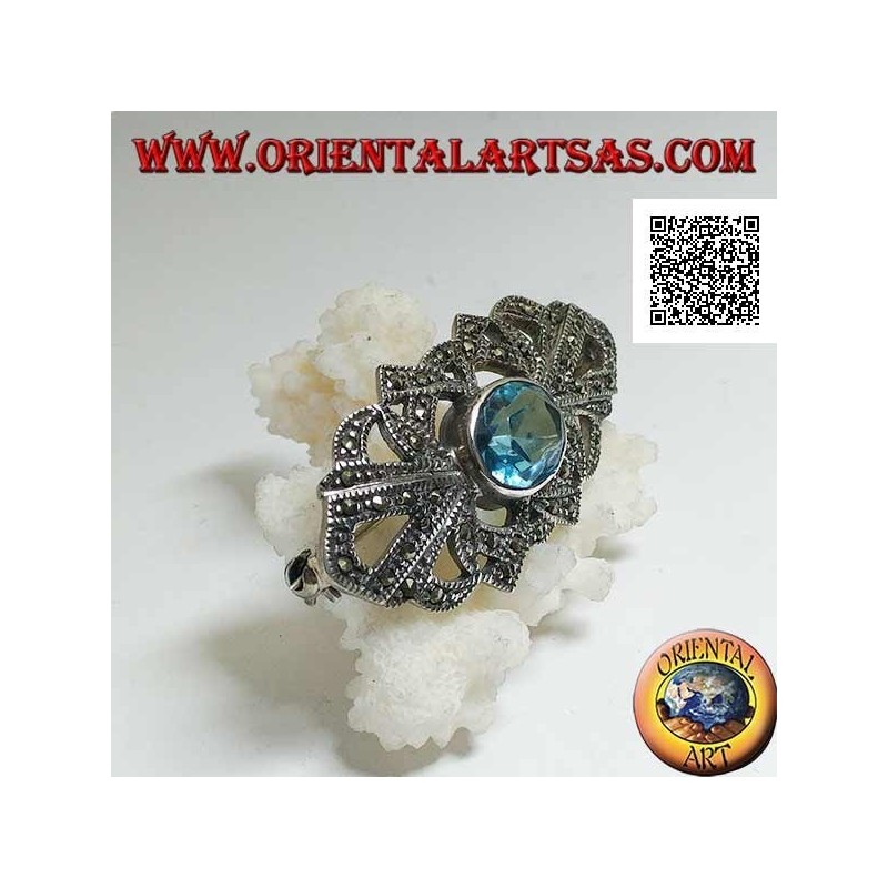 Silver brooch with oval blue topaz and openwork decoration studded with marcasite
