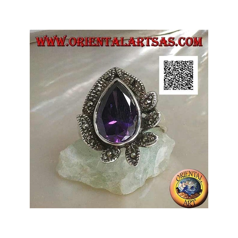 Anillo de plata con una gran gota de circón color amatista rodeado de hojas tachonadas de marcasita