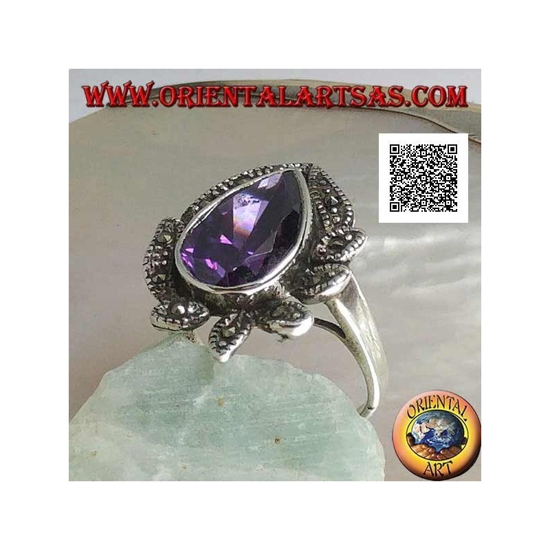 Bague en argent avec gros zircon couleur améthyste entouré de feuilles cloutées de marcassite