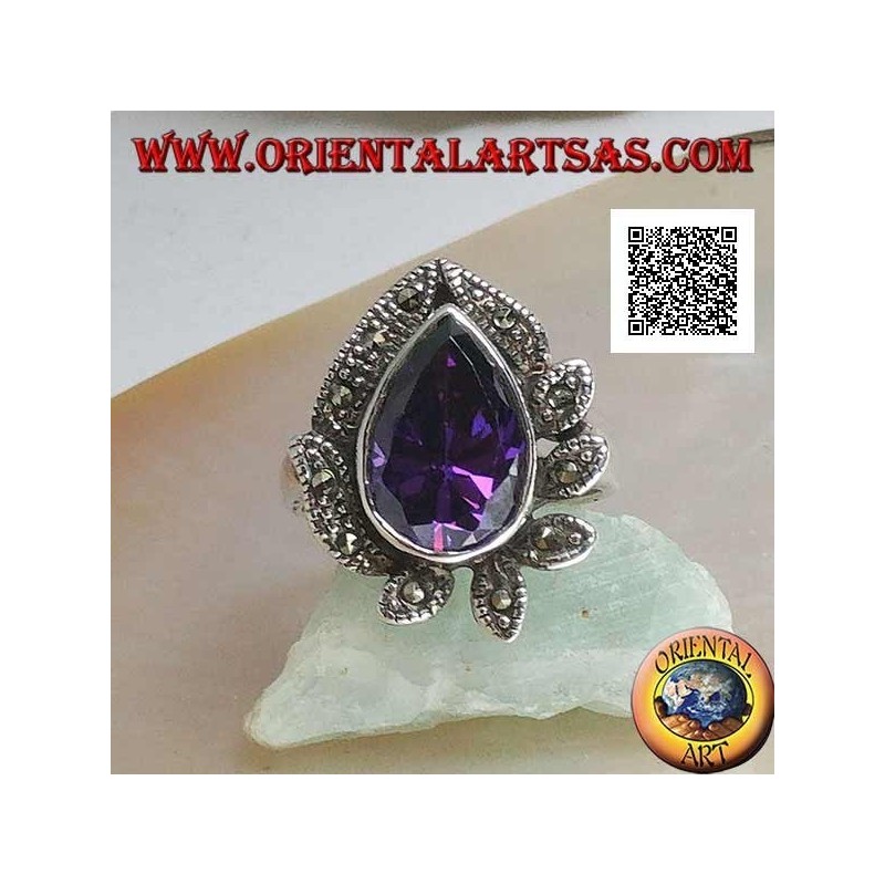 Anillo de plata con una gran gota de circón color amatista rodeado de hojas tachonadas de marcasita