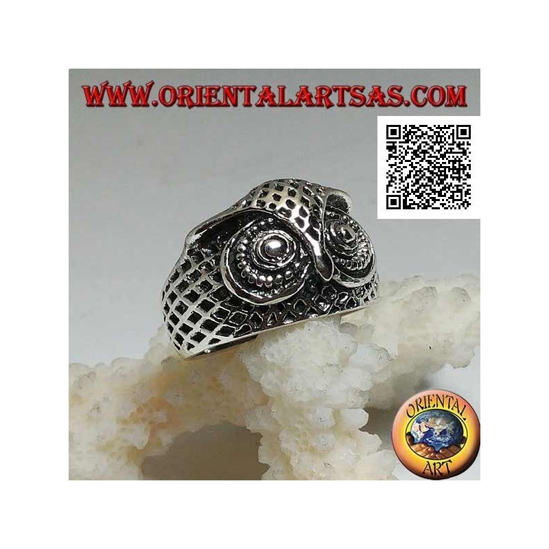 Silver ring in the shape of an owl head with eyes decorated with carvings