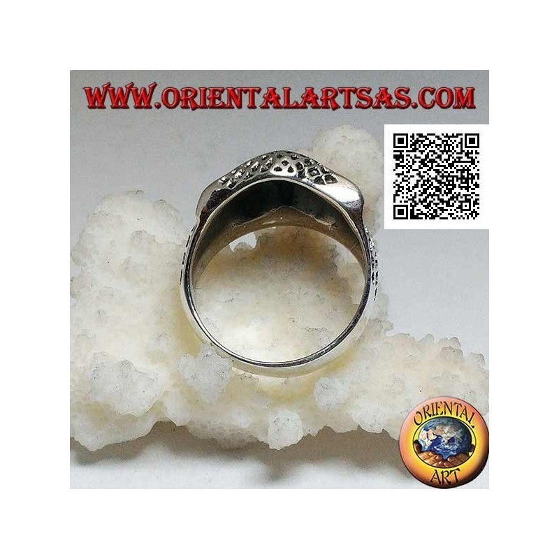 Silver ring in the shape of an owl head with eyes decorated with carvings