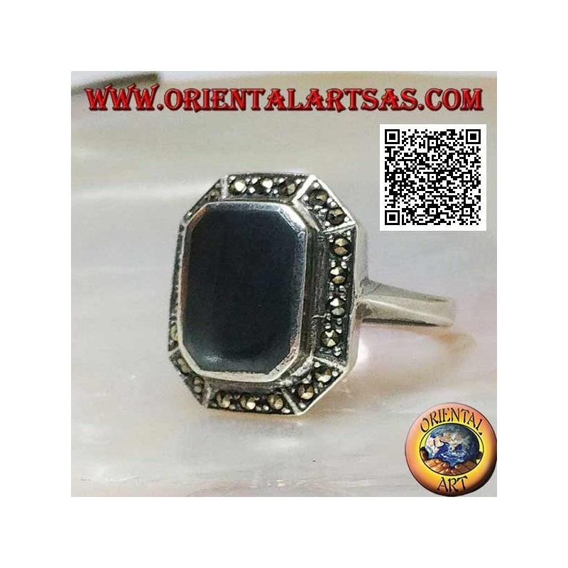 Silver ring with rectangular onyx beveled at the corners surrounded by marcasite