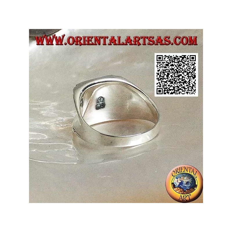 Silver ring with rectangular onyx on a smooth frame with central hollow on the sides
