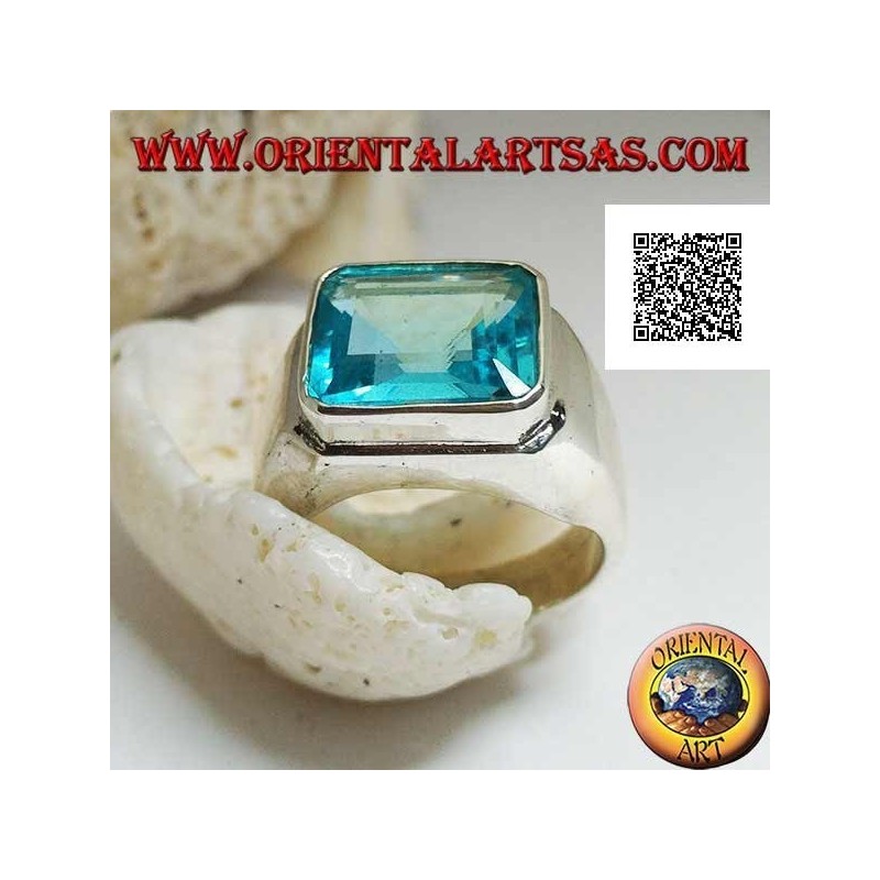 Silver ring with rectangular horizontal blue topaz raised on a smooth frame