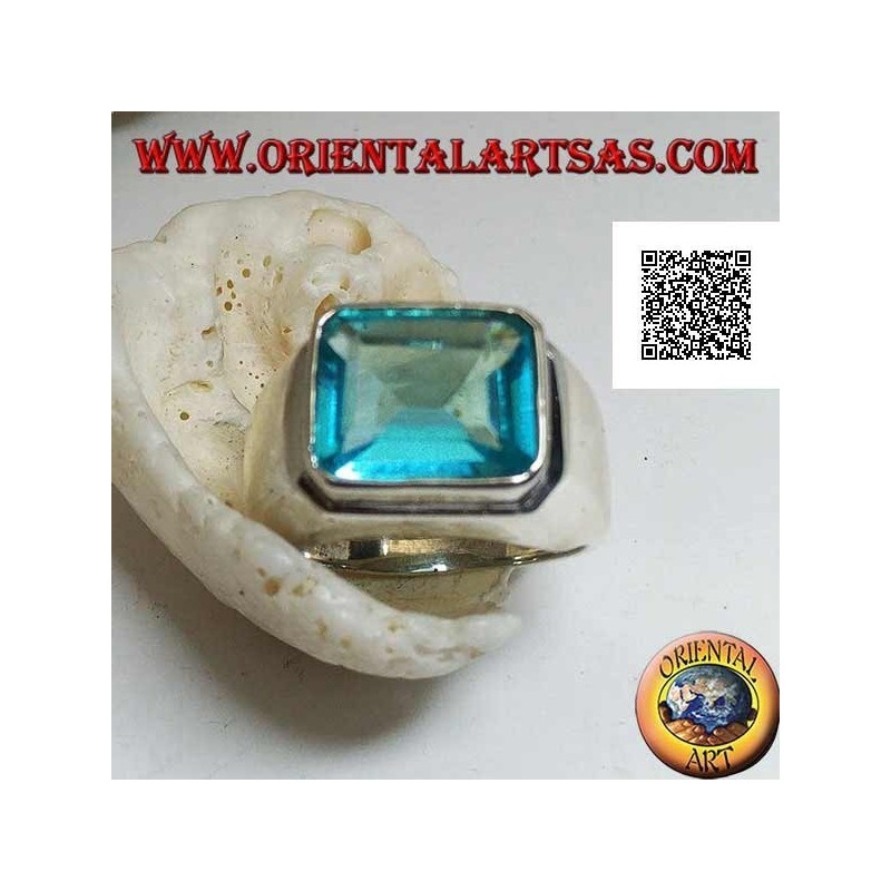 Silver ring with rectangular horizontal blue topaz raised on a smooth frame