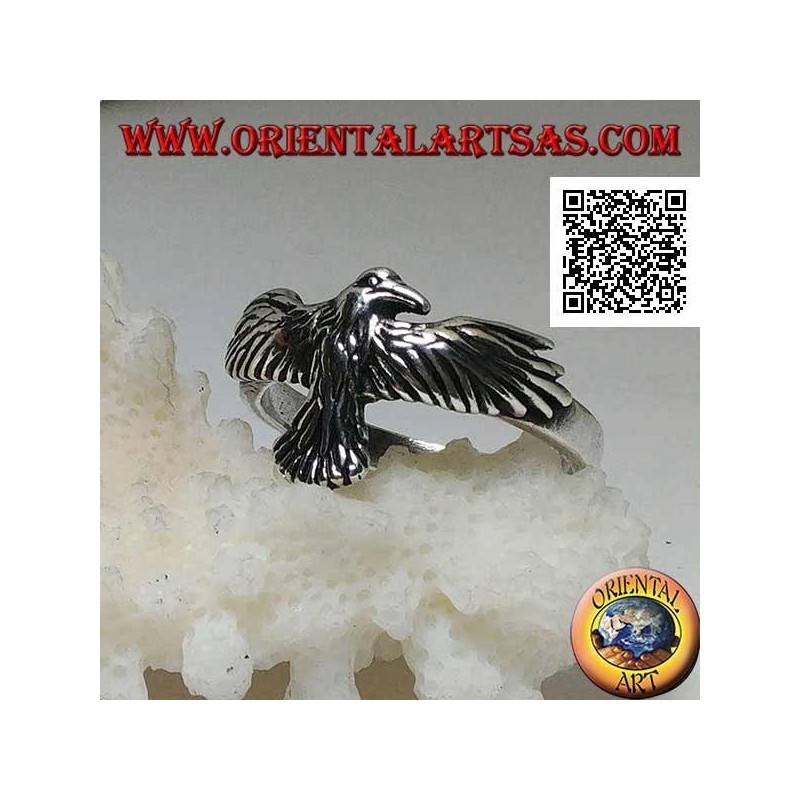 Silver ring with phoenix with spread and spread wings in flight
