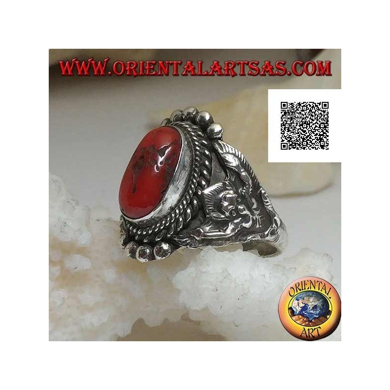 Silver ring with ancient Tibetan coral on Nepalese setting with Garuḍa (progenitor god of birds) on the sides