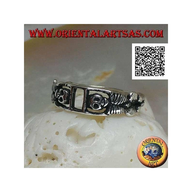 Silver ring composed of two stretched skeletons joined by the arms