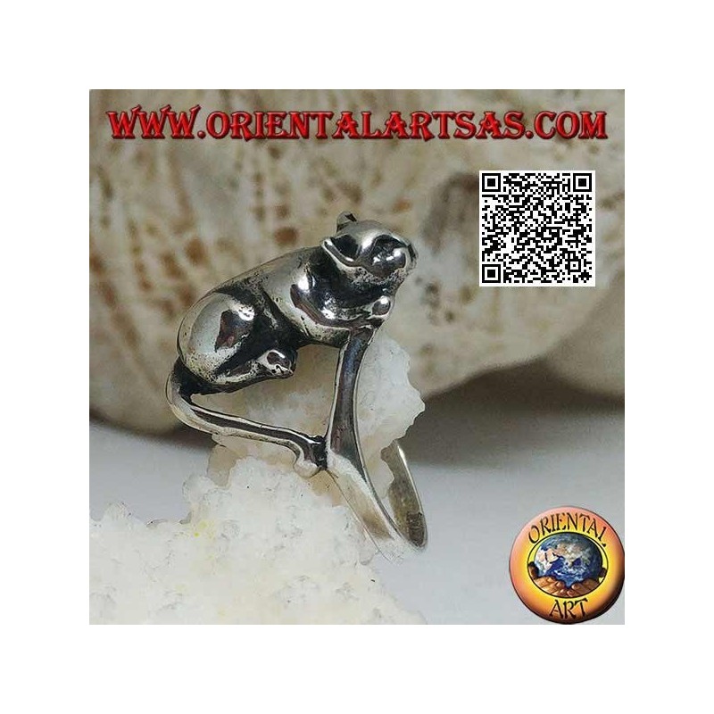 Silver ring with cat lying in an offensive position ready to jump
