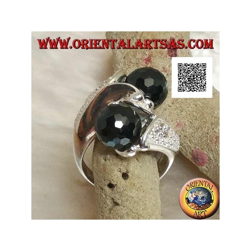 Anello in argento rodiato a due braccia con due sfere di zircone spinello sfaccettato