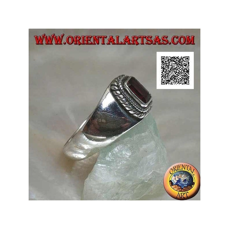 Silver ring with raised rectangular natural garnet surrounded by a double weave