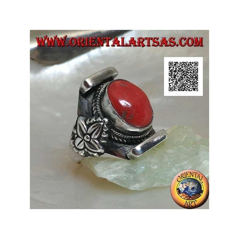 Silver ring with oval antique Tibetan coral in Nepalese setting with leaf on the sides