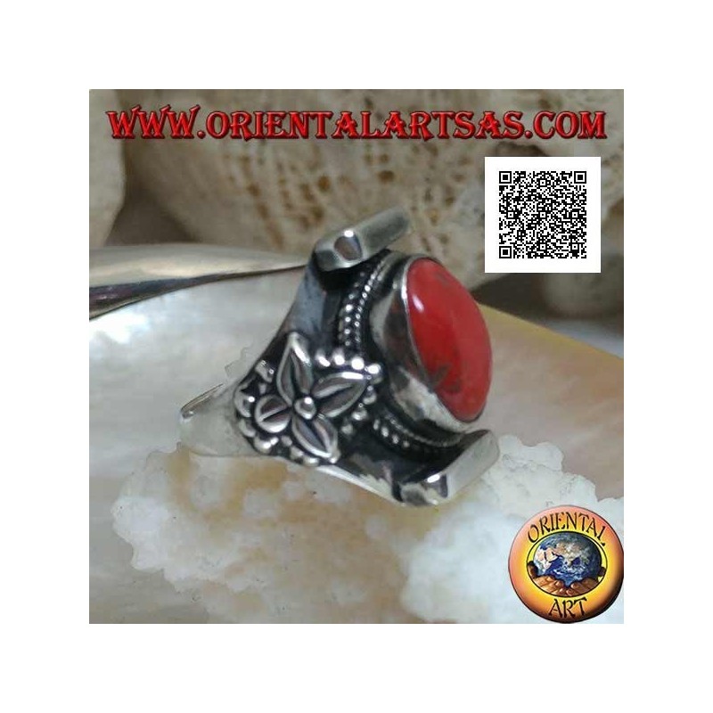 Silver ring with oval antique Tibetan coral in Nepalese setting with leaf on the sides