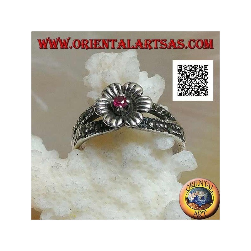 Silver ring in the shape of a flower with round natural garnet set in the center on two rows of marcasite