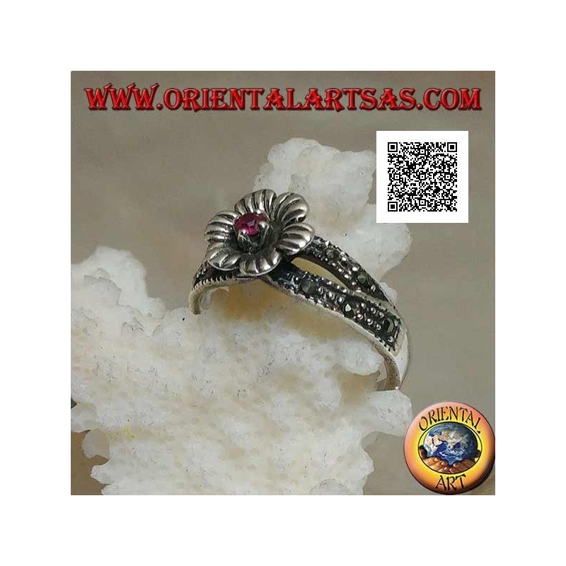 Silver ring in the shape of a flower with round natural garnet set in the center on two rows of marcasite