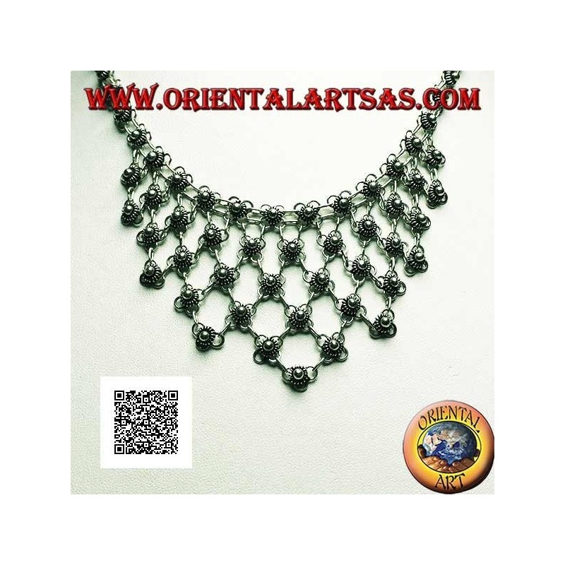 Silver choker necklace of chained flowers with floral decoration on the chest