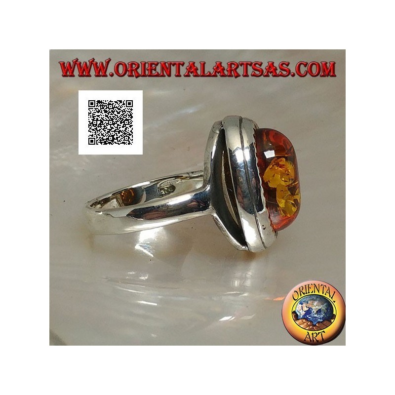 Bague en argent avec cabochon ovale en relief ambre entouré de triangles