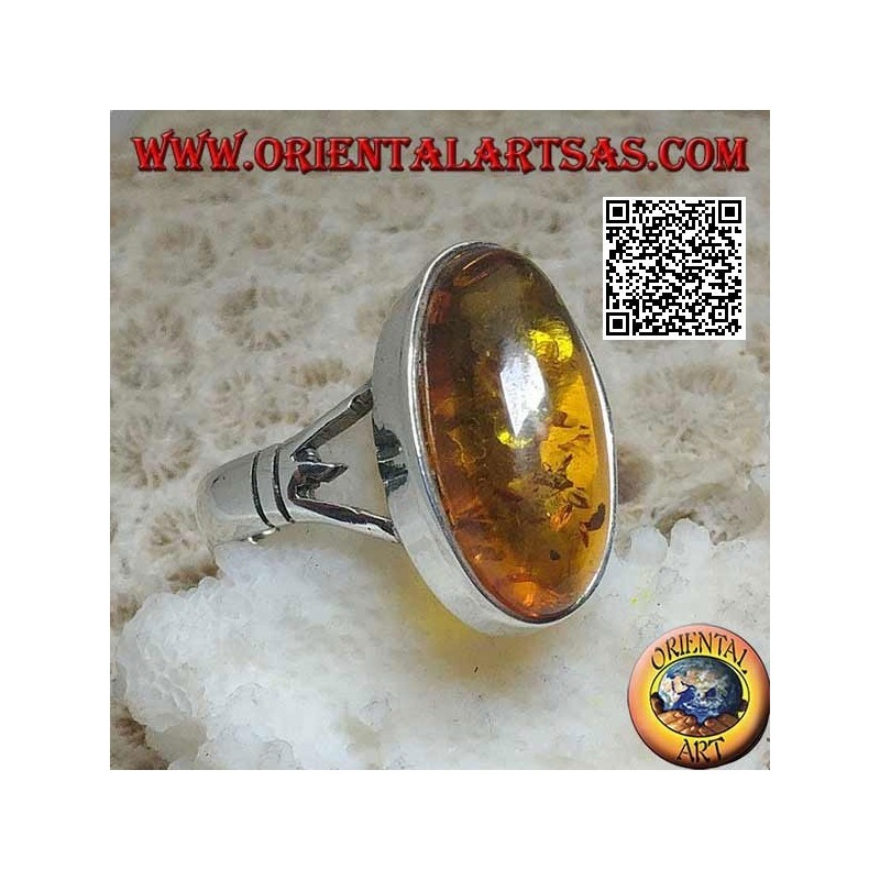 Anillo de plata con un ámbar cabujón ovalado alargado unido a dos