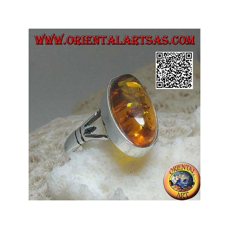 Anillo de plata con un ámbar cabujón ovalado alargado unido a dos
