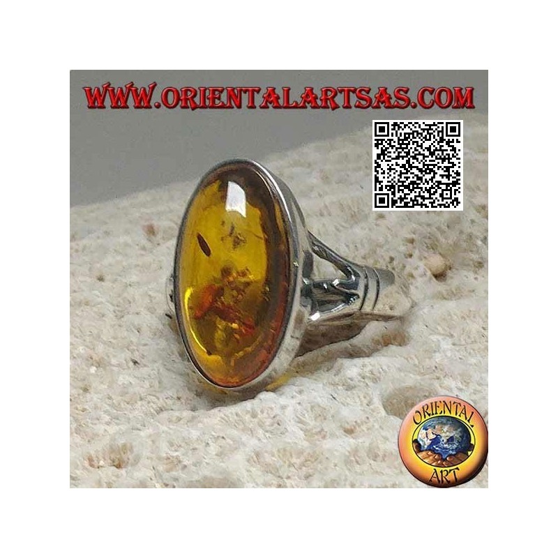 Silver ring with an elongated oval cabochon amber attached to two