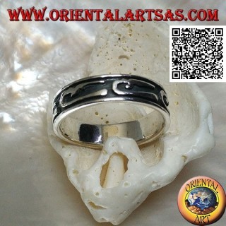 Silver ring with stylized U-shaped designs in bas-relief