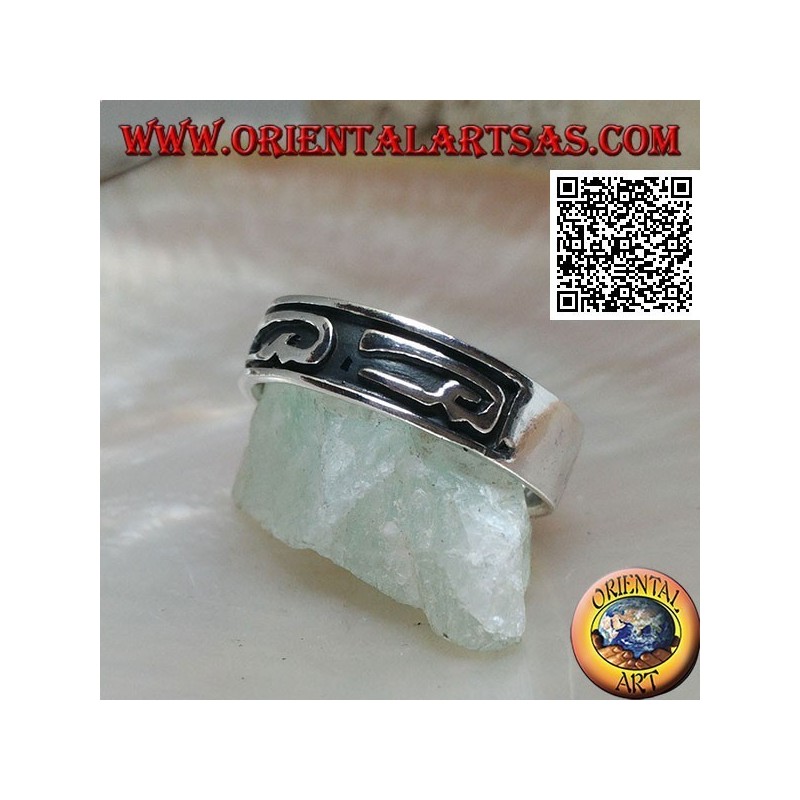 Silver ring with stylized U-shaped designs in bas-relief