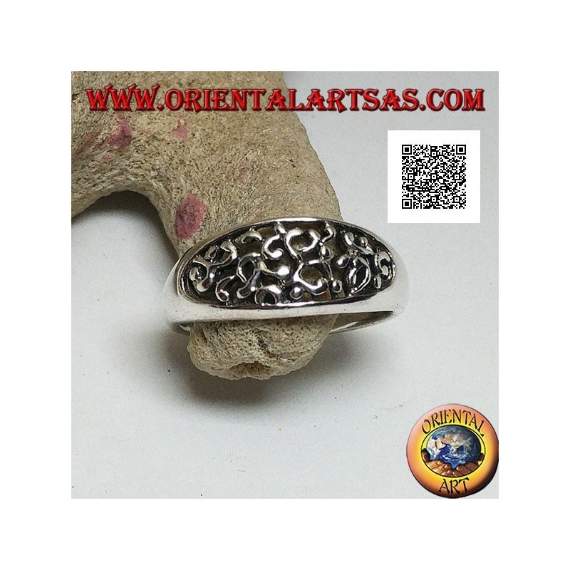 Silver ring with dense openwork decoration on a horizontal oval