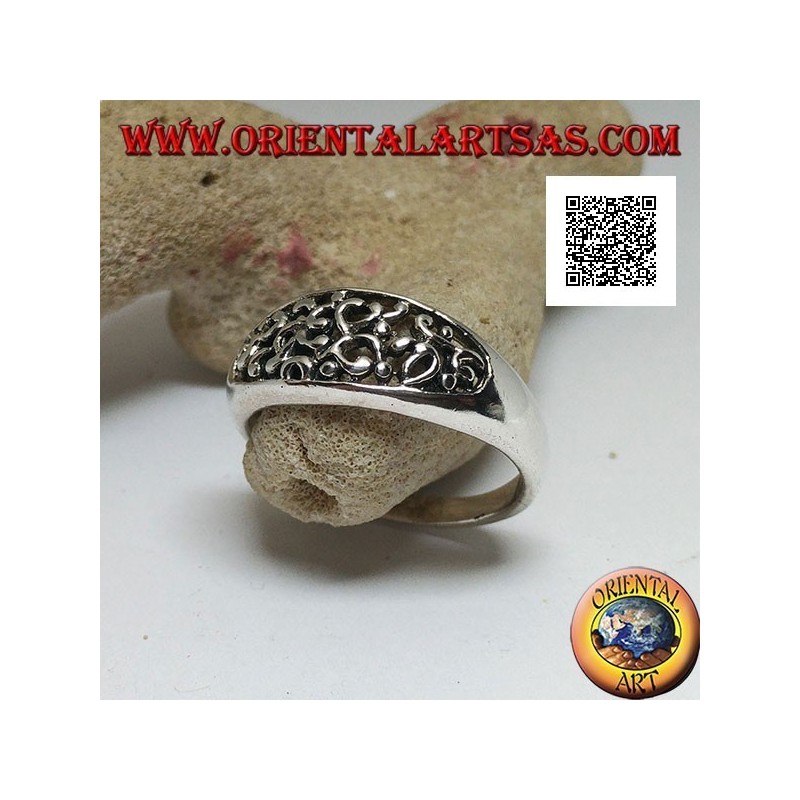 Silver ring with dense openwork decoration on a horizontal oval