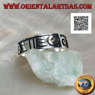 Silver ring with spirals and Maori drawings in bas-relief