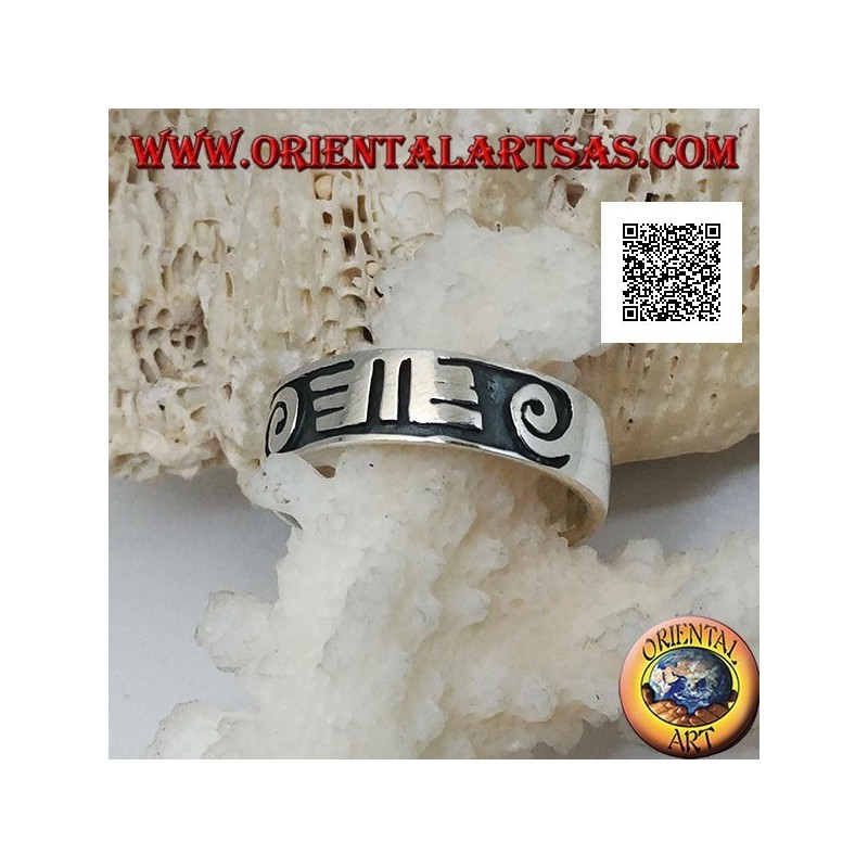 Silver ring with spirals and Maori drawings in bas-relief