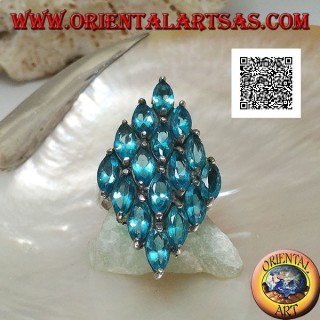 Silver ring in the shape of a rhombus formed by 16 oval blue topazes set