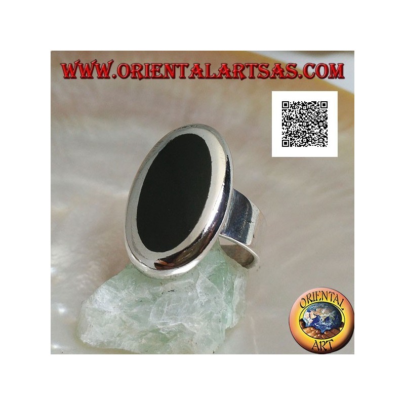Silver ring with oval onyx set flush with the edge with smooth contour