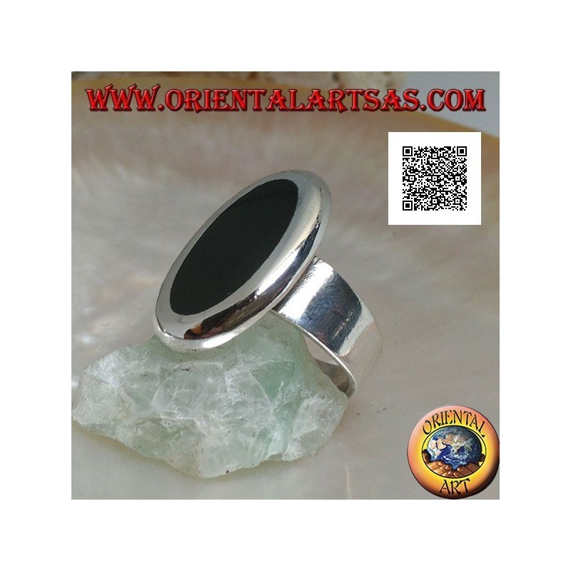 Silver ring with oval onyx set flush with the edge with smooth contour