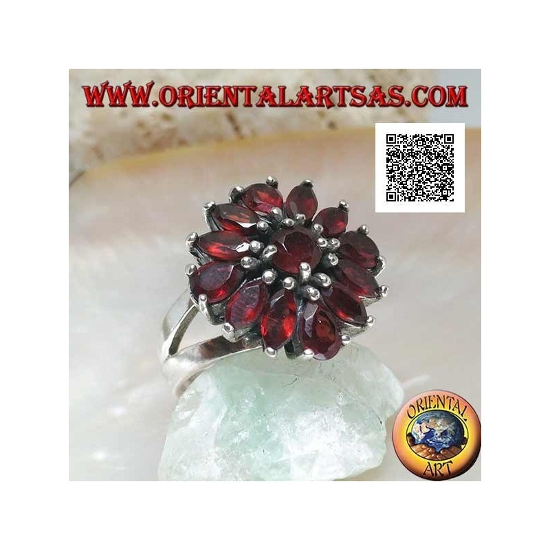 Silver ring with raised flower of 13 natural round, shuttle and drop shaped garnets, set