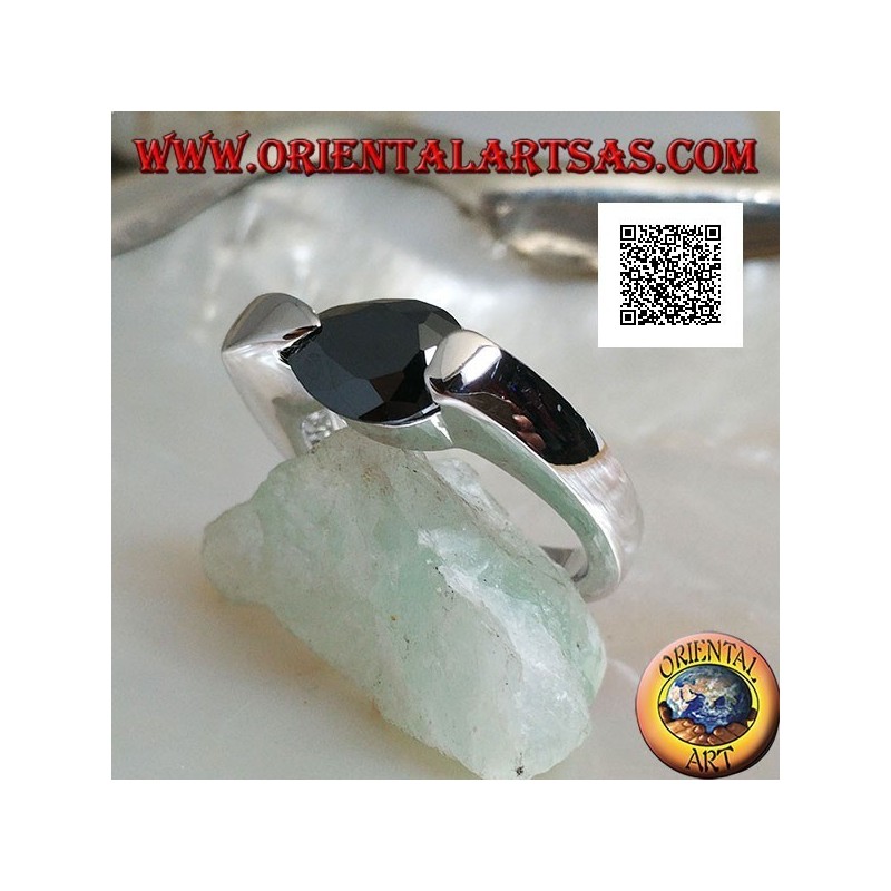 Rhodium silver ring with faceted drop-shaped spinel zircon hooked on the side