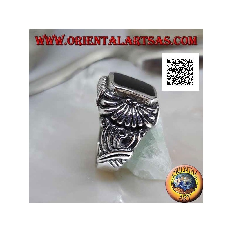 Silver ring with rectangular beveled onyx and curved lines pattern engraved in relief