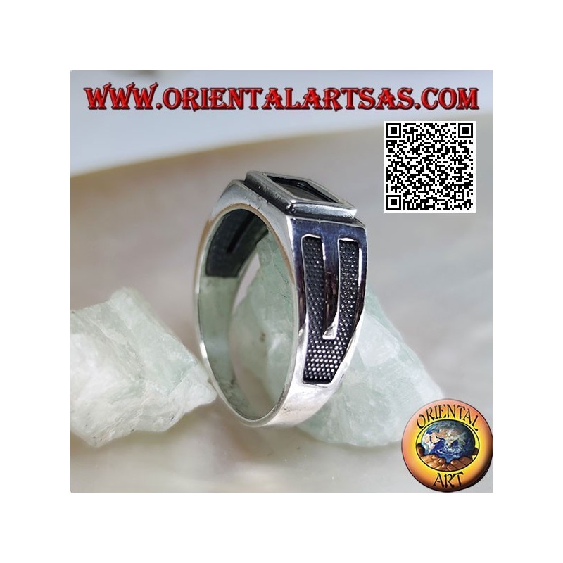 Silver ring with rectangular onyx edged and recessed V on the sides