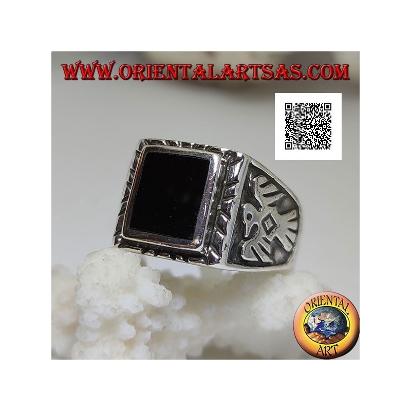 Silver ring with raised rectangular onyx and bas-relief eagle on the sides