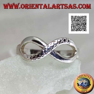 Silver ring with infinity knot symbol with one smooth line and the other snake skin