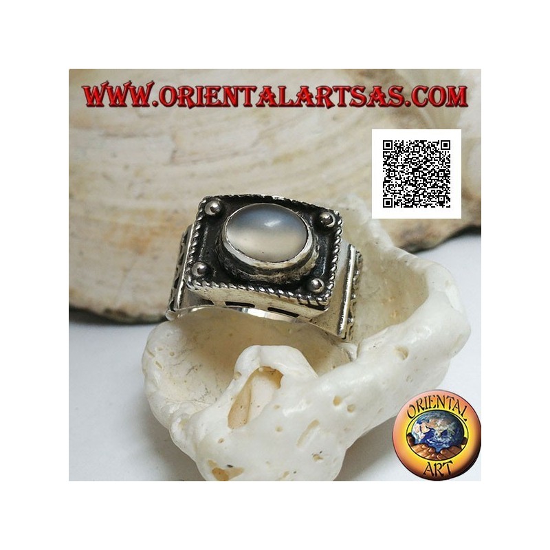 Silver band ring with raised cabochon oval moonstone and ethnic decorations