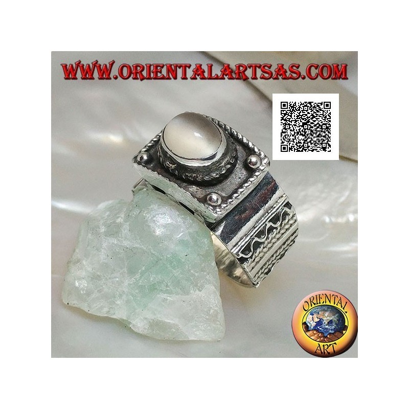 Silver band ring with raised cabochon oval moonstone and ethnic decorations