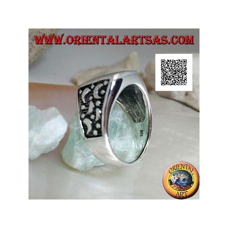 Silver ring with rounded rectangular onyx and moons cut on the sides