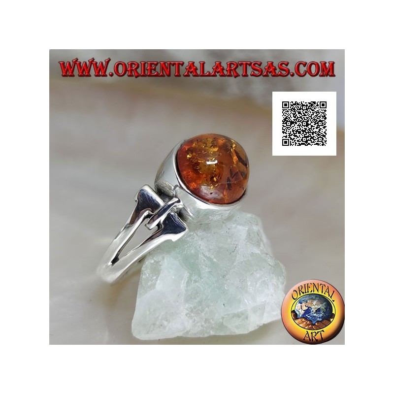 Silver ring with oval cabochon amber crosswise with elongated triangular hole