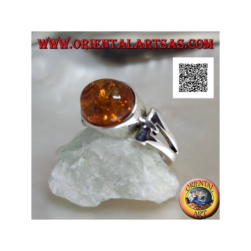Silver ring with oval cabochon amber crosswise with elongated triangular hole