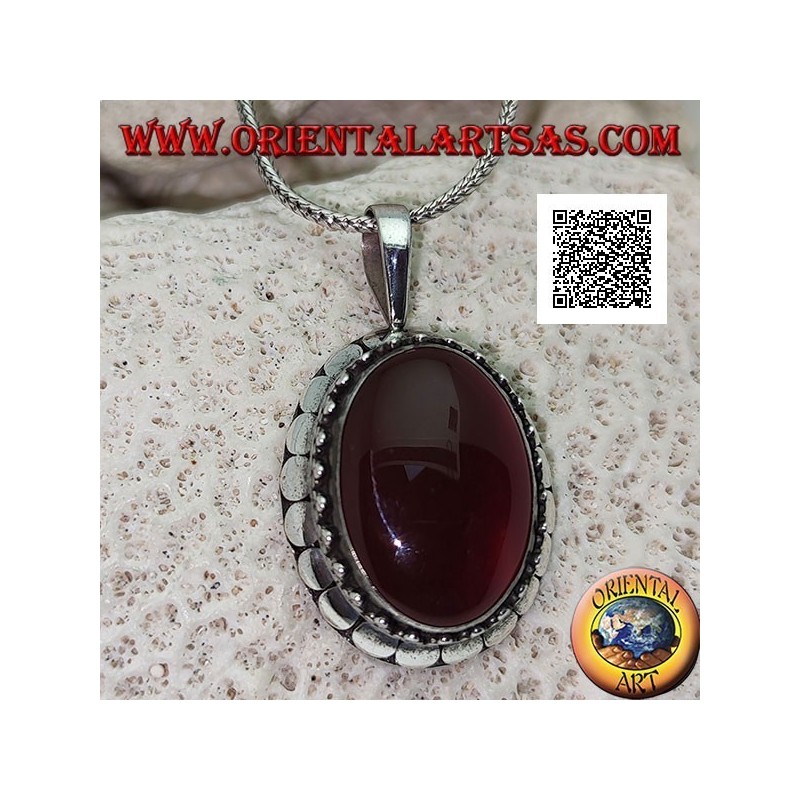 Silver pendant with large oval cabochon carnelian surrounded by trio of balls and studs